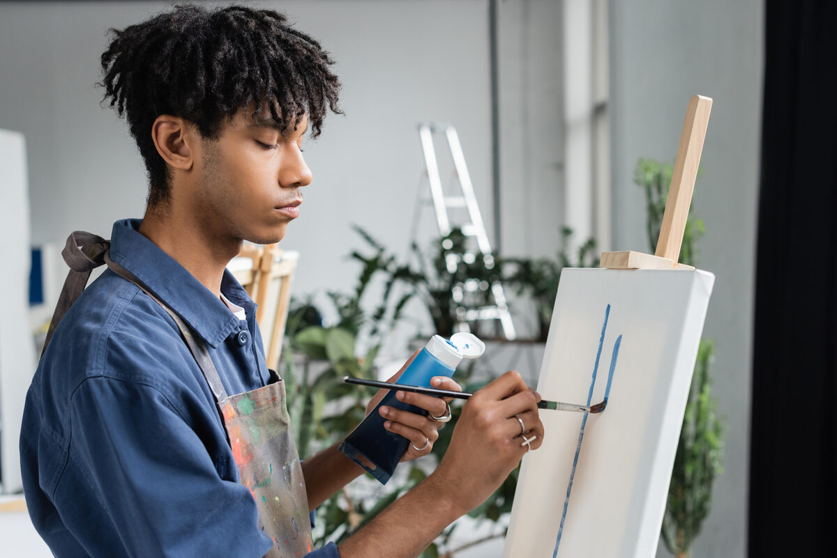 Devon Blake working on a canvas